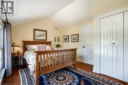 Bedroom #2 with hardwood / wood-style floors, lofted ceiling, and a closet - 849 Beach Boulevard, Hamilton, ON - Indoor Photo Showing Bedroom