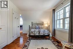 Bedroom #3 featuring lofted ceiling and wood-type flooring - 