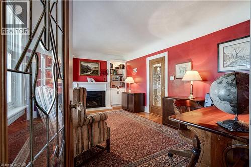 Office area featuring a fireplace with raised hearth - 849 Beach Boulevard, Hamilton, ON - Indoor With Fireplace