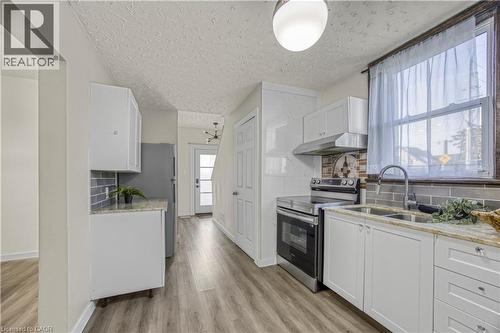 130 Stirton Street, Hamilton, ON - Indoor Photo Showing Kitchen With Double Sink