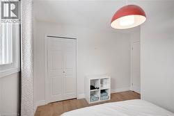 Bedroom with light wood finished floors - 