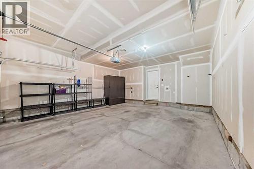 238 Panatella  Nw, Calgary, AB - Indoor Photo Showing Garage