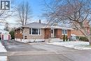View of front facade with a chimney, brick siding, a storage unit, and stone siding - 557 Lake Street, St. Catharines, ON  - Outdoor With Facade 