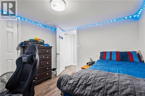 Bedroom featuring wood finished floors - 557 Lake Street, St. Catharines, ON - Indoor Photo Showing Bedroom