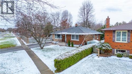 View of front of house with a chimney and brick siding - 557 Lake Street, St. Catharines, ON - Outdoor
