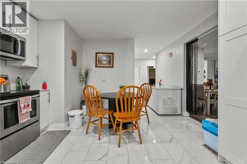 Dining space featuring light marble finish floors - 557 Lake Street, St. Catharines, ON - Indoor