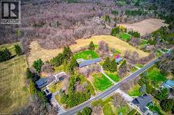 Birds eye view of property with a wooded view - 