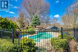 View of swimming pool featuring fence and a fenced in pool - 