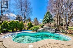 Outdoor pool featuring fence - 