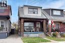 View of front of house with brick siding, a porch, and a shingled roof - 69 Gage Avenue N, Hamilton, ON  - Outdoor 