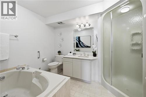 Bathroom with vanity, a shower stall, and a garden tub - 2170 Marine Drive Unit# 1808, Oakville, ON - Indoor Photo Showing Bathroom