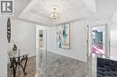 Hallway featuring a chandelier and granite floors - 2170 Marine Drive Unit# 1808, Oakville, ON  - Indoor Photo Showing Other Room 
