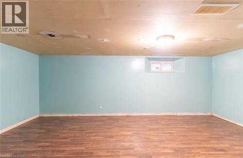 Basement featuring wood finished floors - 219 Erie Avenue, Brantford, ON - Indoor Photo Showing Other Room