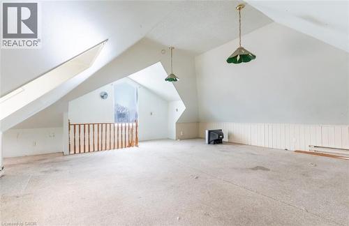 Bonus room with lofted ceiling, a skylight, and carpet flooring - 219 Erie Avenue, Brantford, ON - 