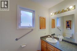 Bathroom featuring vanity and toilet - 