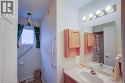 Bathroom with vanity and baseboards - 