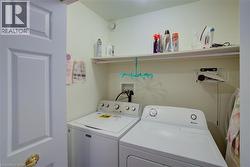 Laundry room with separate washer and dryer - 
