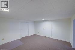 Finished basement with carpet and recessed lighting - 