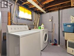 Laundry area featuring washing machine and clothes dryer - 