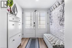 Entryway featuring wood finished floors - 