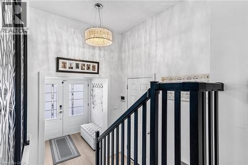 Entryway featuring wood finished floors, french doors, and a high ceiling - 136 Limpert Avenue, Cambridge, ON - Indoor Photo Showing Other Room