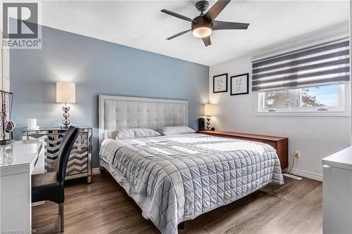 Bedroom featuring wood finished floors and a ceiling fan - 136 Limpert Avenue, Cambridge, ON - Indoor Photo Showing Bedroom