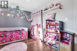 Bedroom with wood finished floors - 