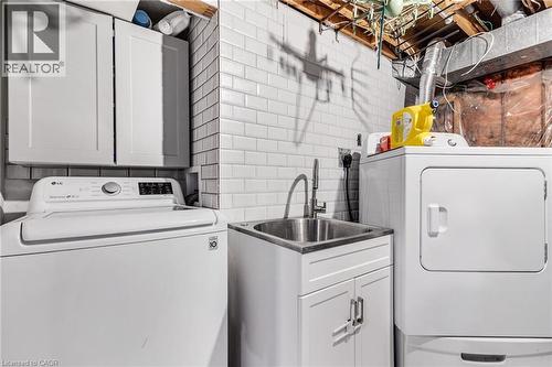 Washroom featuring cabinet space and washer and dryer - 136 Limpert Avenue, Cambridge, ON - Indoor Photo Showing Laundry Room