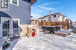 Snowy yard featuring a hot tub - 