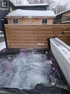 View of patio with a hot tub - 