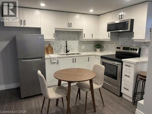 Virtually Staged - 373 East 27Th Street, Hamilton, ON - Indoor Photo Showing Kitchen With Double Sink