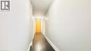 Hallway with baseboards and dark wood-style flooring - 155 St. Leger Unit# 107, Kitchener, ON  - Indoor Photo Showing Other Room 