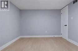 Spare room with light wood-style floors and baseboards - 