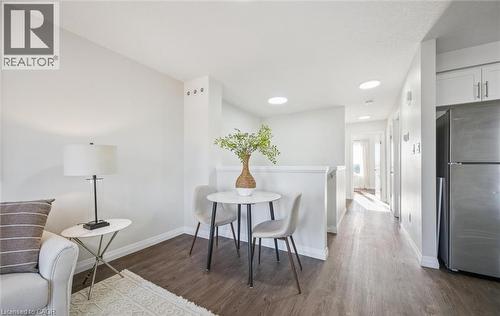 Dining space featuring dark wood finished floors and recessed lighting - 24 Morrison Road Unit# D9, Kitchener, ON - Indoor