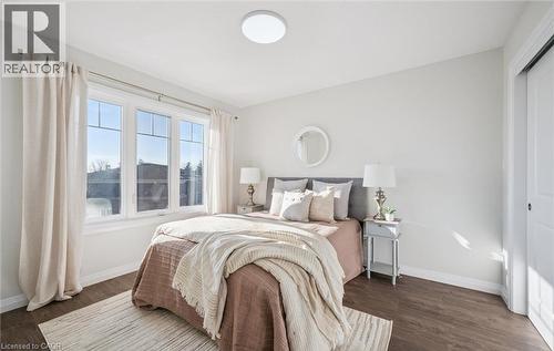 Bedroom featuring dark wood finished floors - 24 Morrison Road Unit# D9, Kitchener, ON - Indoor Photo Showing Bedroom