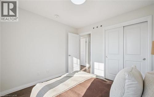 Bedroom featuring a closet and wood finished floors - 24 Morrison Road Unit# D9, Kitchener, ON - Indoor Photo Showing Bedroom