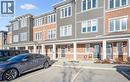 View of property with uncovered parking and a residential view - 24 Morrison Road Unit# D9, Kitchener, ON  - Outdoor With Facade 