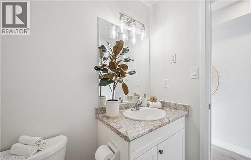 Bathroom with vanity and light wood-style flooring - 24 Morrison Road Unit# D9, Kitchener, ON - Indoor Photo Showing Bathroom