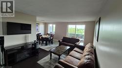 Living area with dark  flooring and baseboards - 