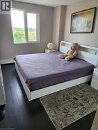 Bedroom featuring finished floors and baseboards - 