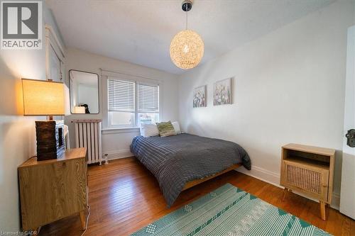 Bedroom with radiator and wood-type flooring - 184 Weber Street E, Kitchener, ON - Indoor Photo Showing Bedroom