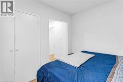 Bedroom with light wood finished floors - 