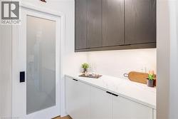 Bar with decorative backsplash and wet bar - 