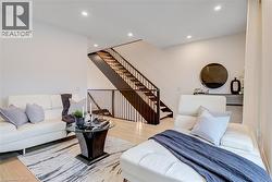 Living area featuring wood finished floors and recessed lighting - 