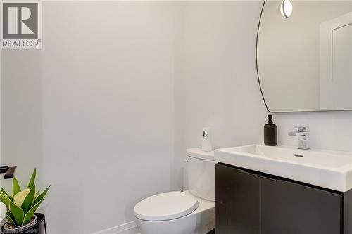 Bathroom featuring toilet, vanity, and baseboards - 151C Port Robinson Road, Pelham, ON - Indoor Photo Showing Bathroom