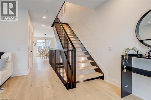 Stairway with baseboards, recessed lighting, and hardwood / wood-style floors - 151C Port Robinson Road, Pelham, ON - Indoor Photo Showing Other Room