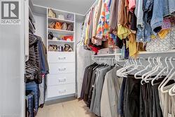 Spacious closet featuring wood finished floors - 