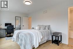 Bedroom with light wood-type flooring - 