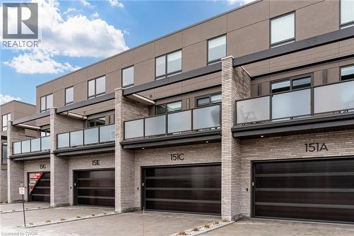 View of building exterior with a garage and driveway - 151C Port Robinson Road, Pelham, ON - Outdoor