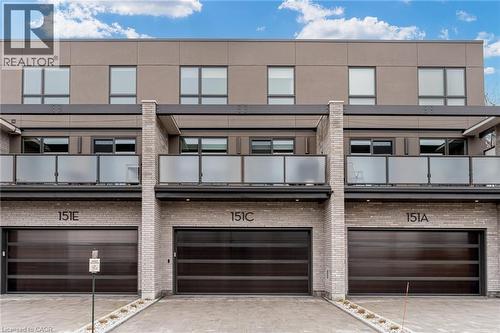 View of front of property featuring brick siding, driveway, and a garage - 151C Port Robinson Road, Pelham, ON - Outdoor With Facade